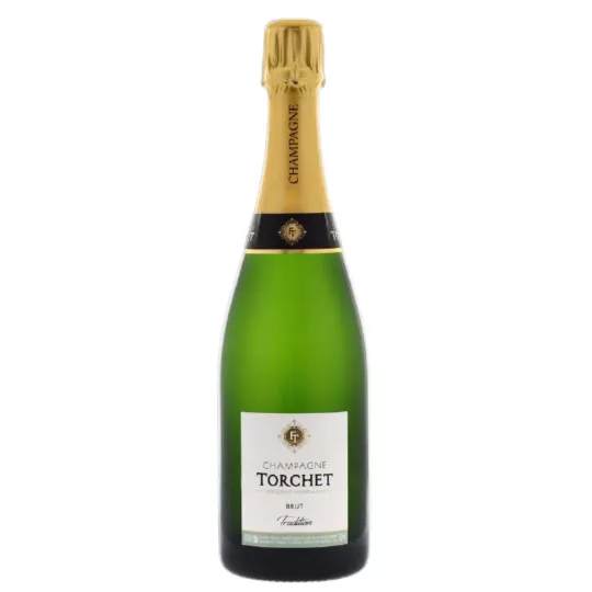 Bottle of Champagne LAËTITIA TORCHET Brut Tradition being served.