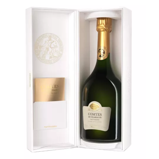 Botella de Champagne Taittinger Comtes de Champagne 2013, vista frontal, etiqueta blanca y tapón dorado.